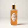 Liquid soap bottle with a label on a plain background