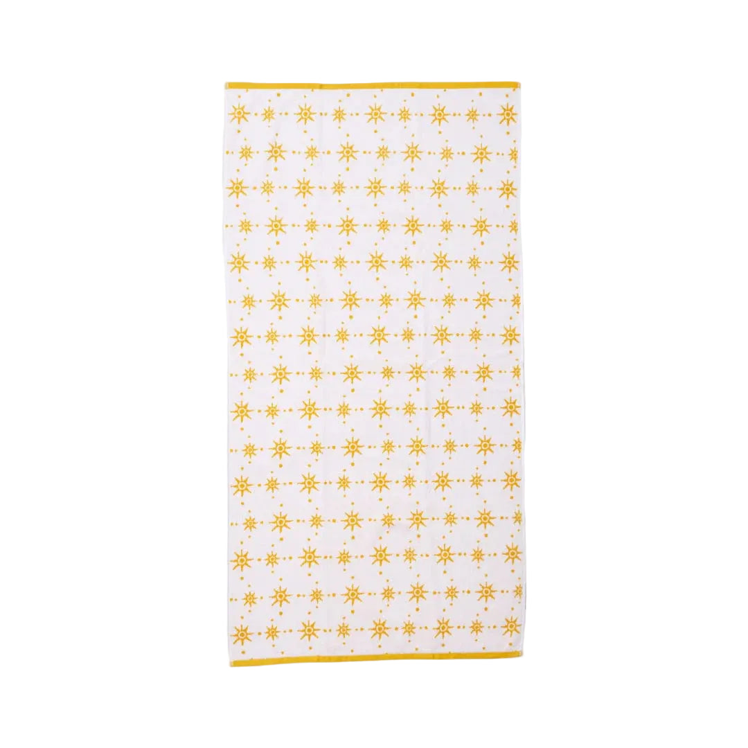 White towel with yellow geometric pattern on a white background