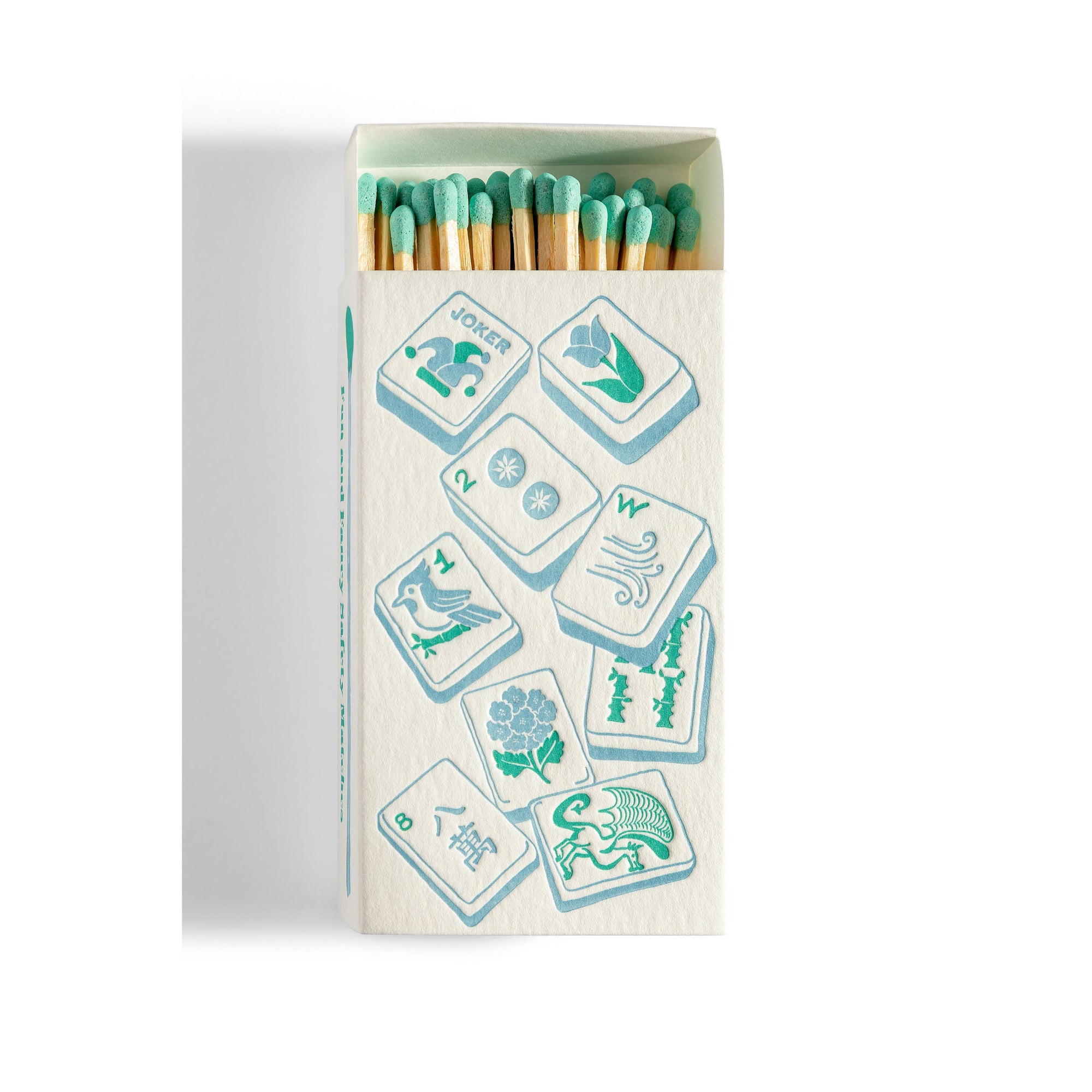 Matchbox with Mahjong tiles on front of box on white background 