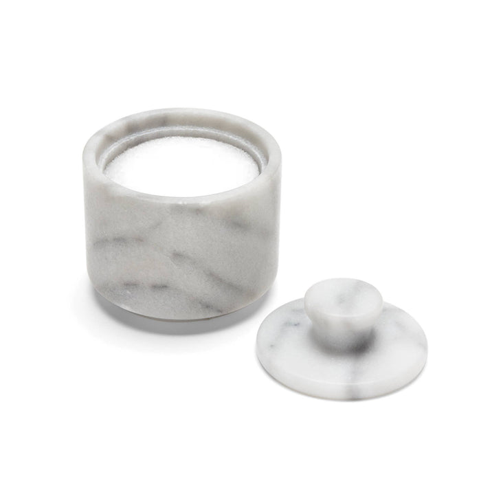 Marble-textured salt jar with lid on a white background