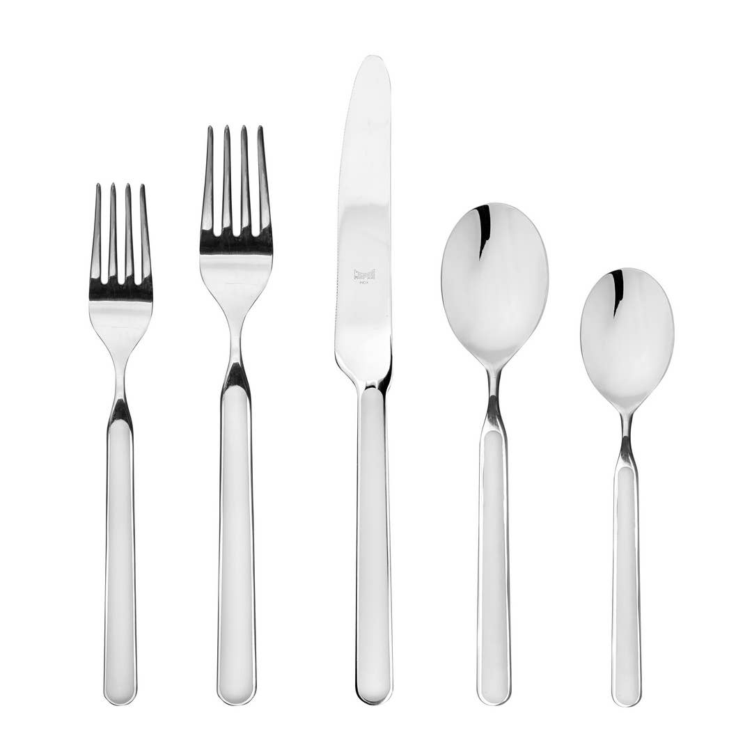 Five piece Italian flatware set in white with 2 forks, knife and 2 spoons on white background 