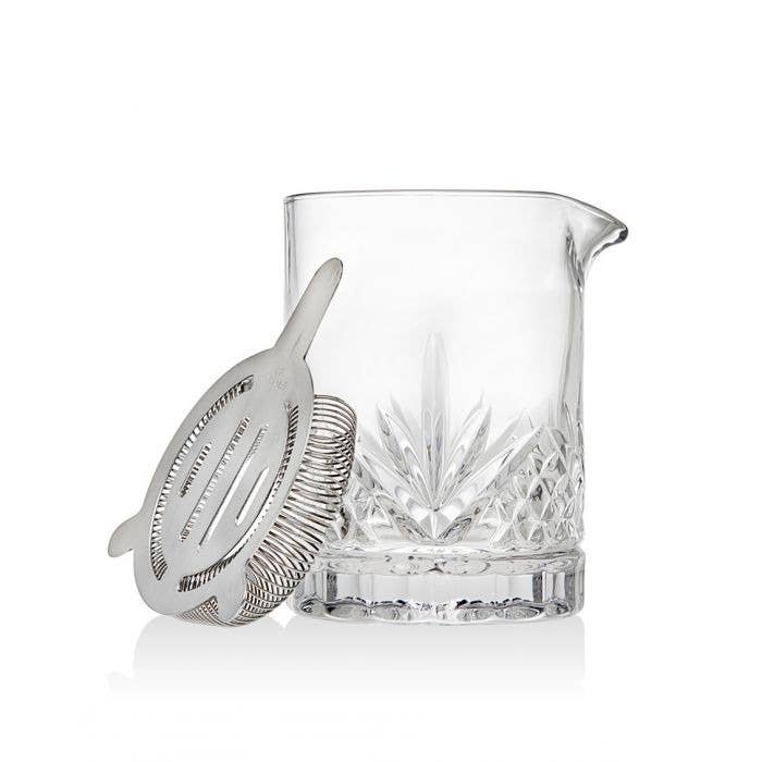 Mini mixing pitcher with strainer on white background 