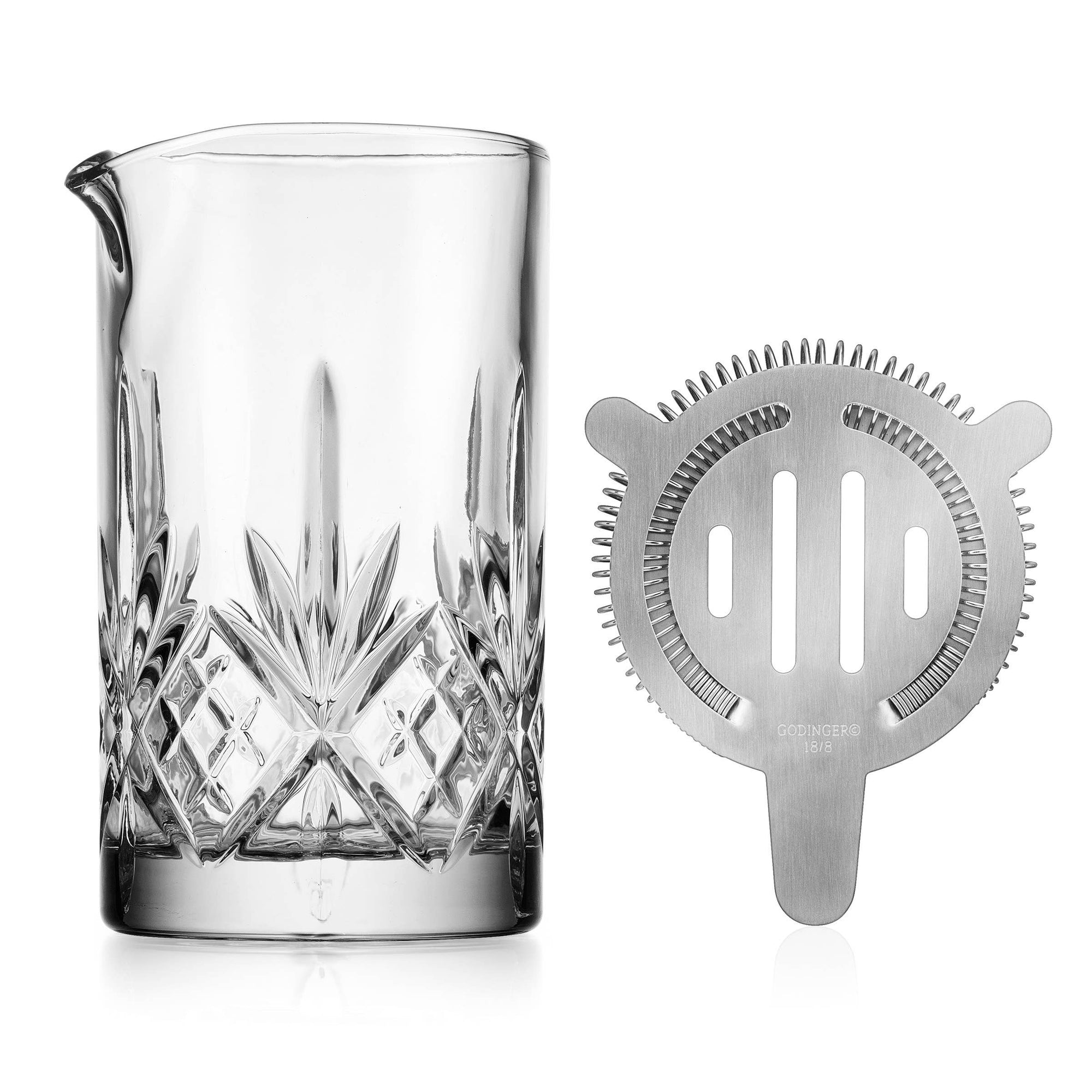 An unleaded crystal mixing pitcher with strainer on white background 