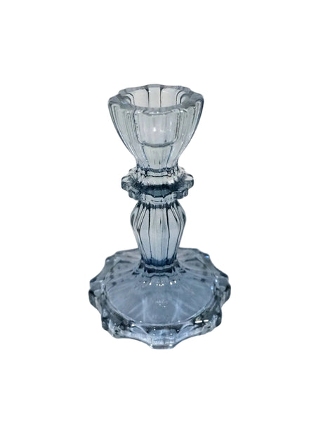 Blue glass candlestick on a white background