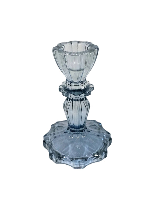 Blue glass candlestick on a white background