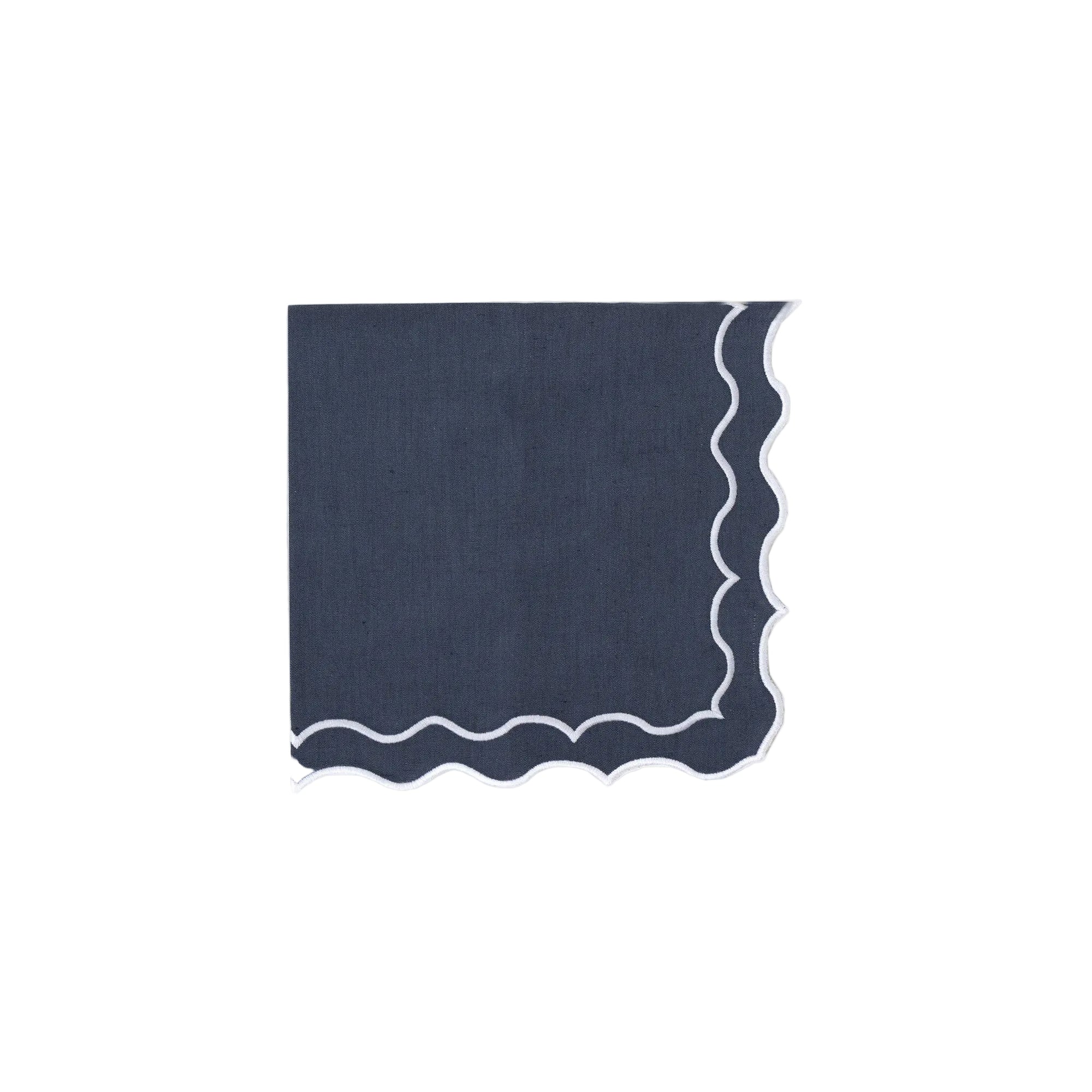 Navy blue napkin with wavy edge on a white background