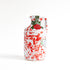 Red splatter ceramic bottle of extra virgin olive oil on white background 