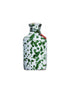 Green splatter ceramic bottle of extra virgin olive oil with cork top on white background 