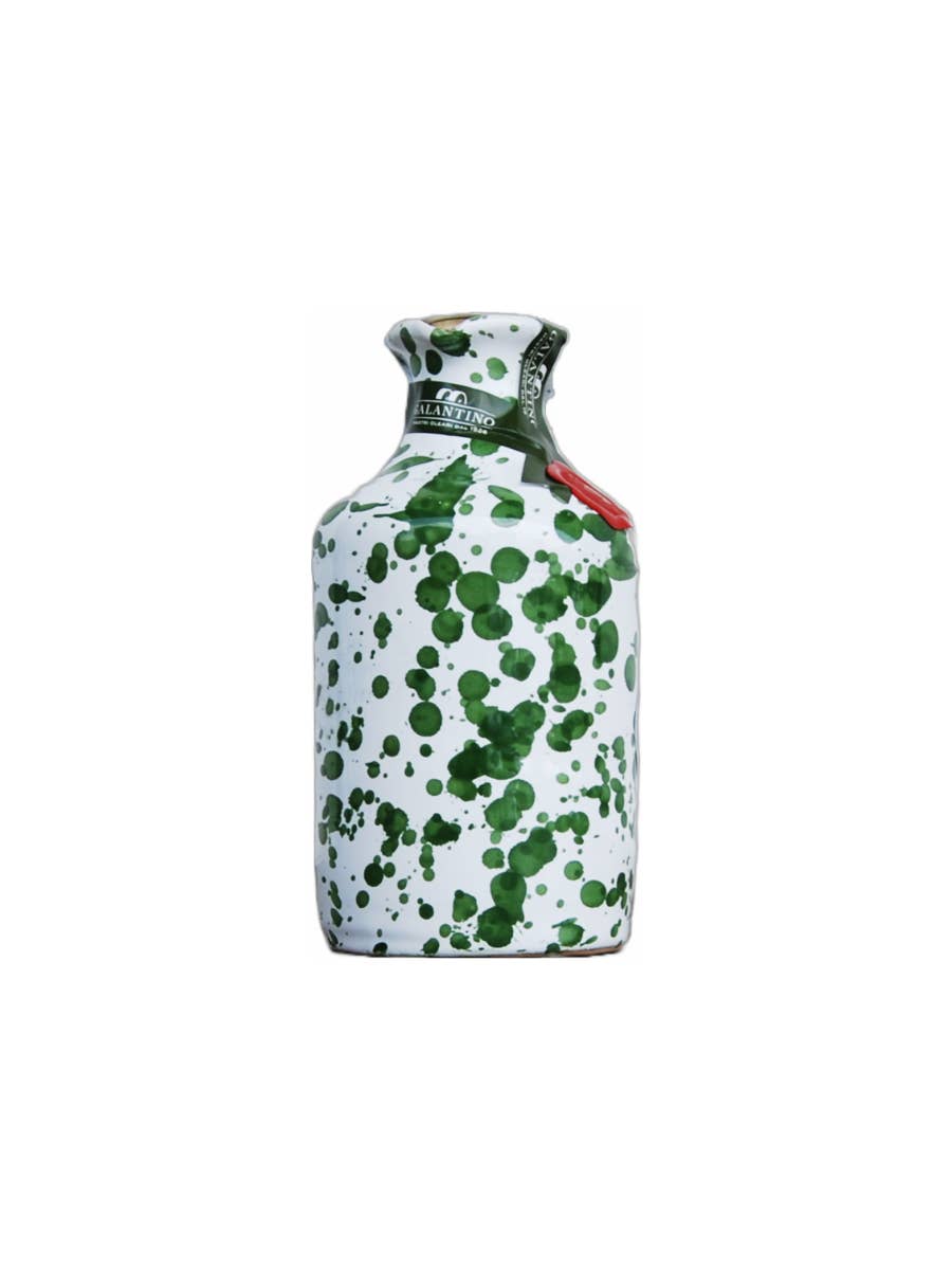 Green splatter ceramic bottle of extra virgin olive oil with cork top on white background 