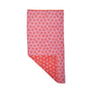 Pink and red patterned fabric on a white background