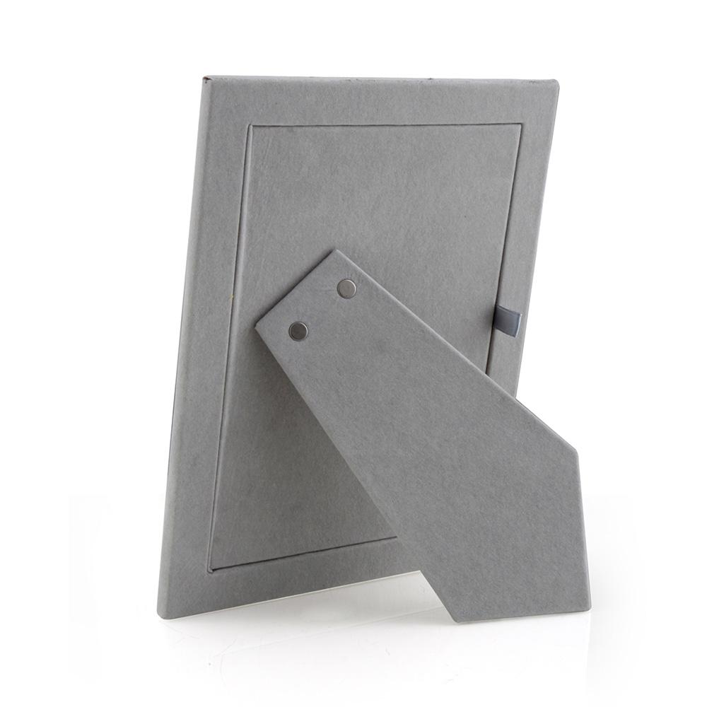 Grey velvet backing with pull ribbon on picture frame