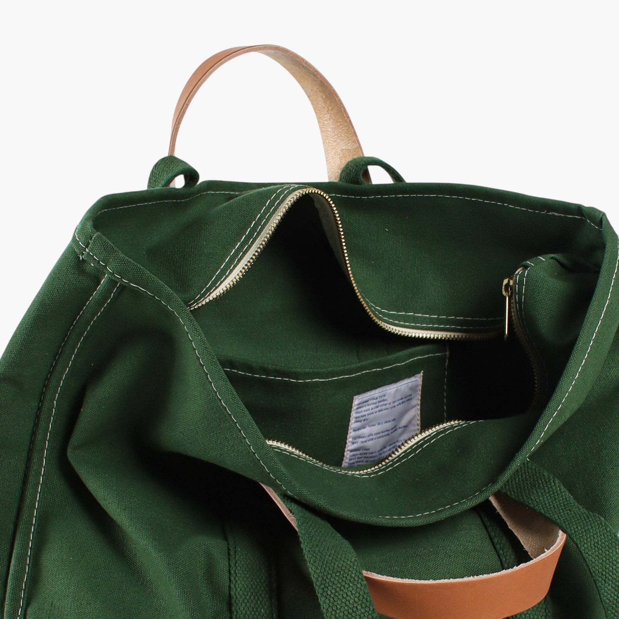 Zipper tote bag with inside pocket and detachable leather handles and canvas straps 