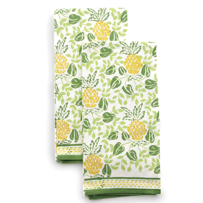 Two kitchen towels with pineapple pattern on a white background