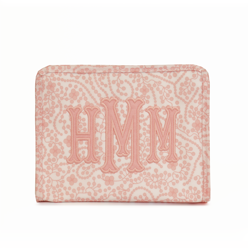 Cosmetic bag with pink detail on white background 