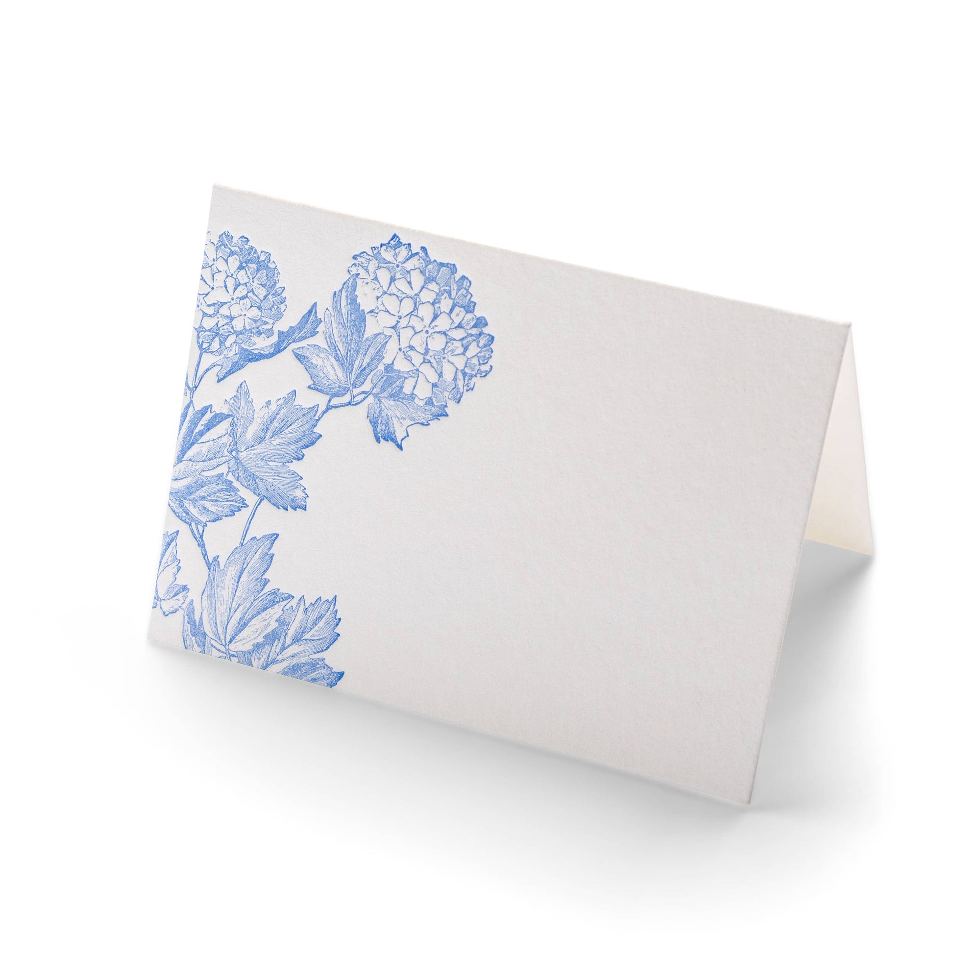 White card stock folding place cards with blue hydrangea on white background 