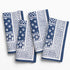 Set of blue and white patterned napkins on a white background