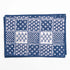 Blue and white patterned fabric with a grid of various designs on a white background