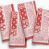 Set of red and white patterned napkins on a white background