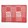 Red bandana with white patterns on a white background