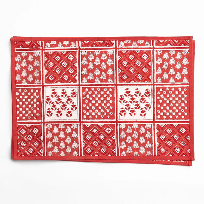 Red bandana with white patterns on a white background