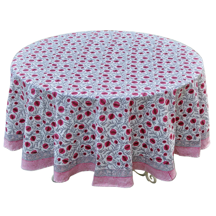 Round tablecloth with pink floral pattern on grass