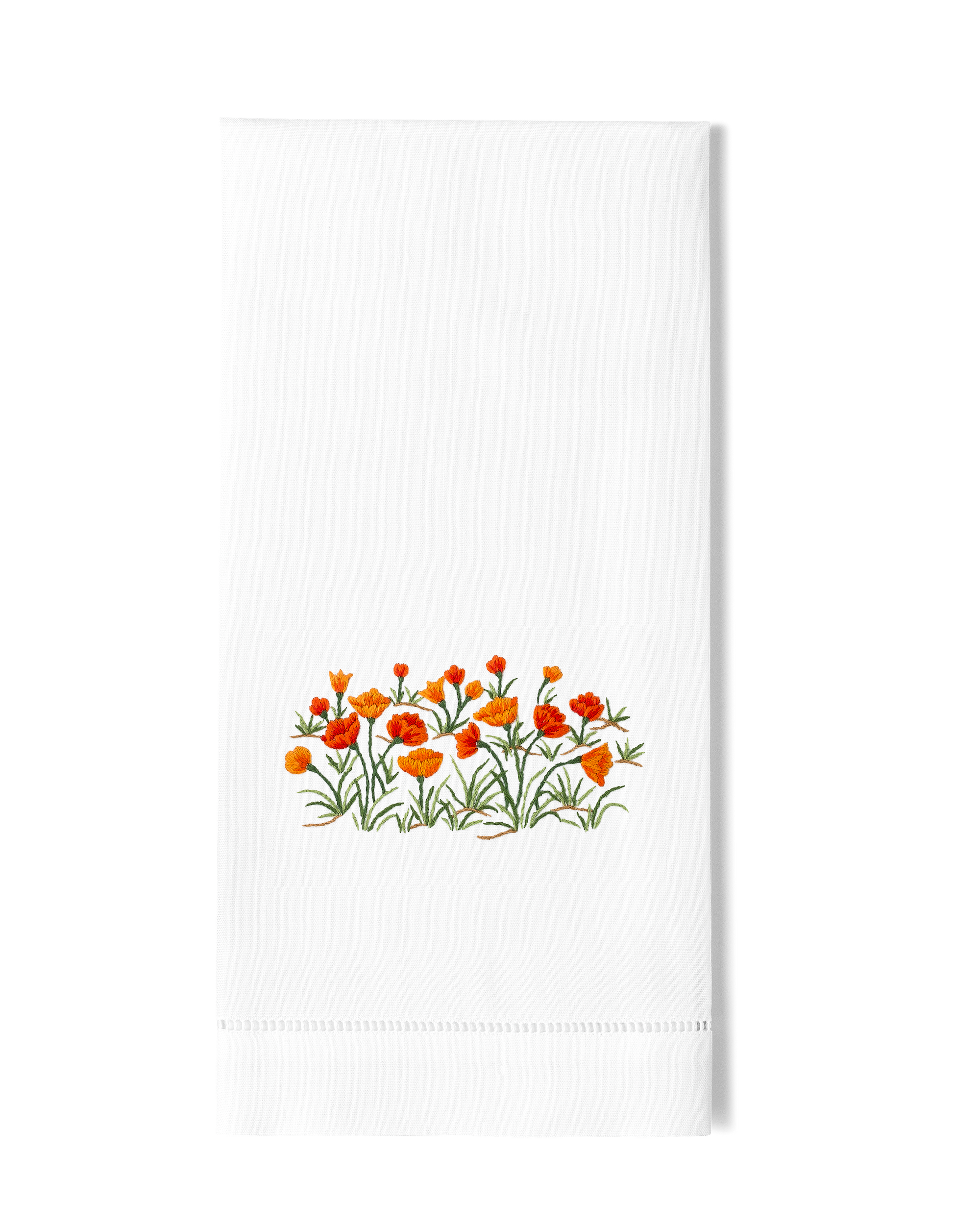 White towel with orange floral design on a white background