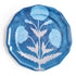 Blue melamine plate with floral design on a white background
