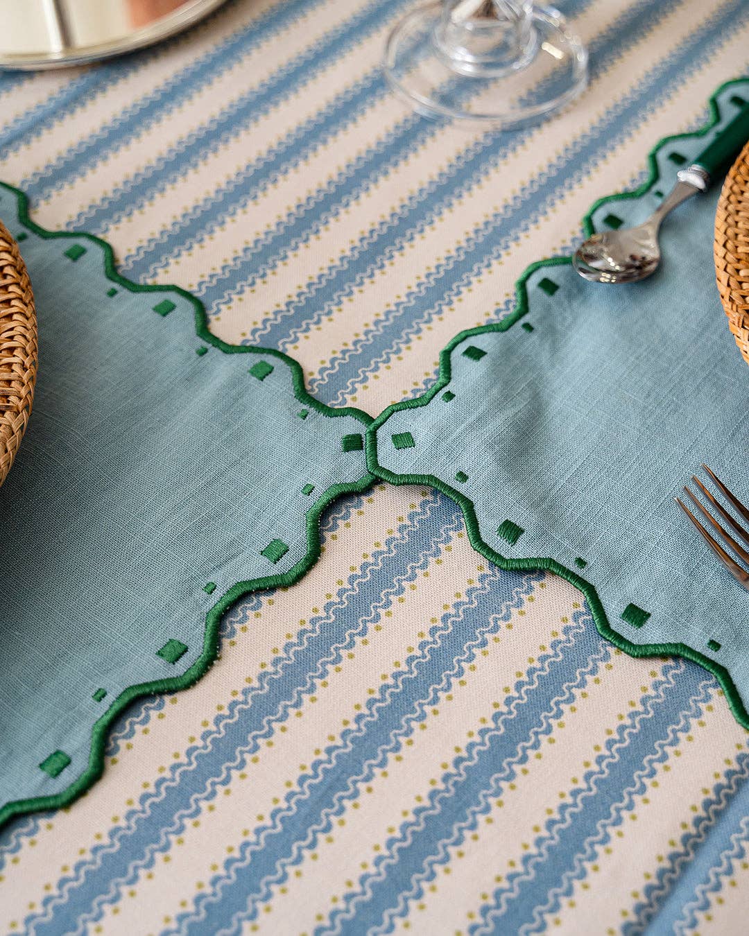 Decorative tablecloth with geometric patterns on a table setting.