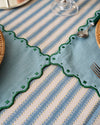 Decorative tablecloth with geometric patterns on a table setting.