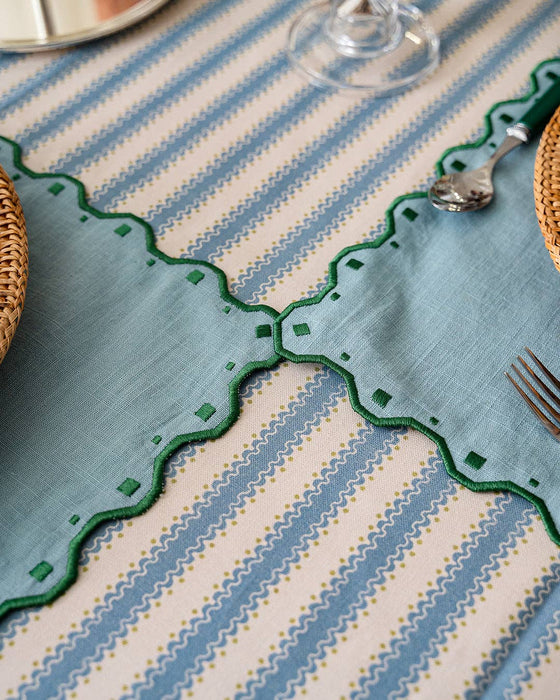 Decorative tablecloth with geometric patterns on a table setting.
