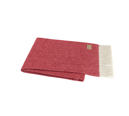 Red blanket with white fringe on a white background