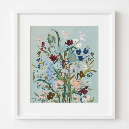 Framed floral artwork on a light blue background