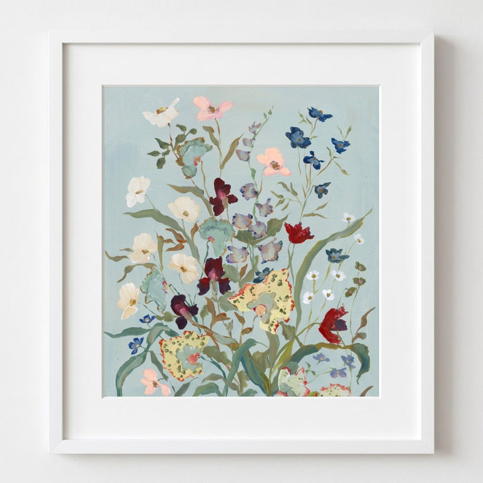 Framed floral artwork with colorful flowers on a light blue background
