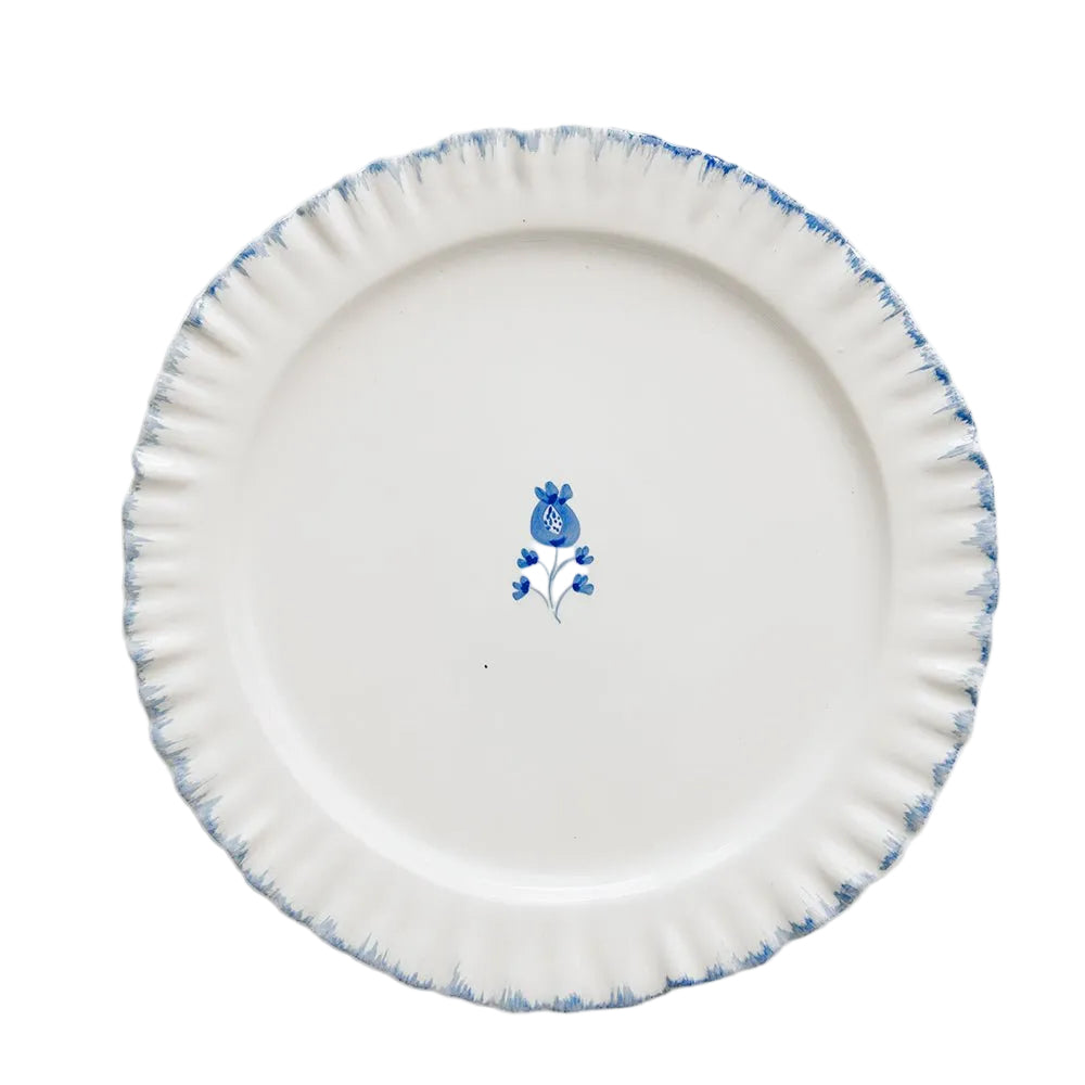 White ceramic plate with blue floral design on a white background
