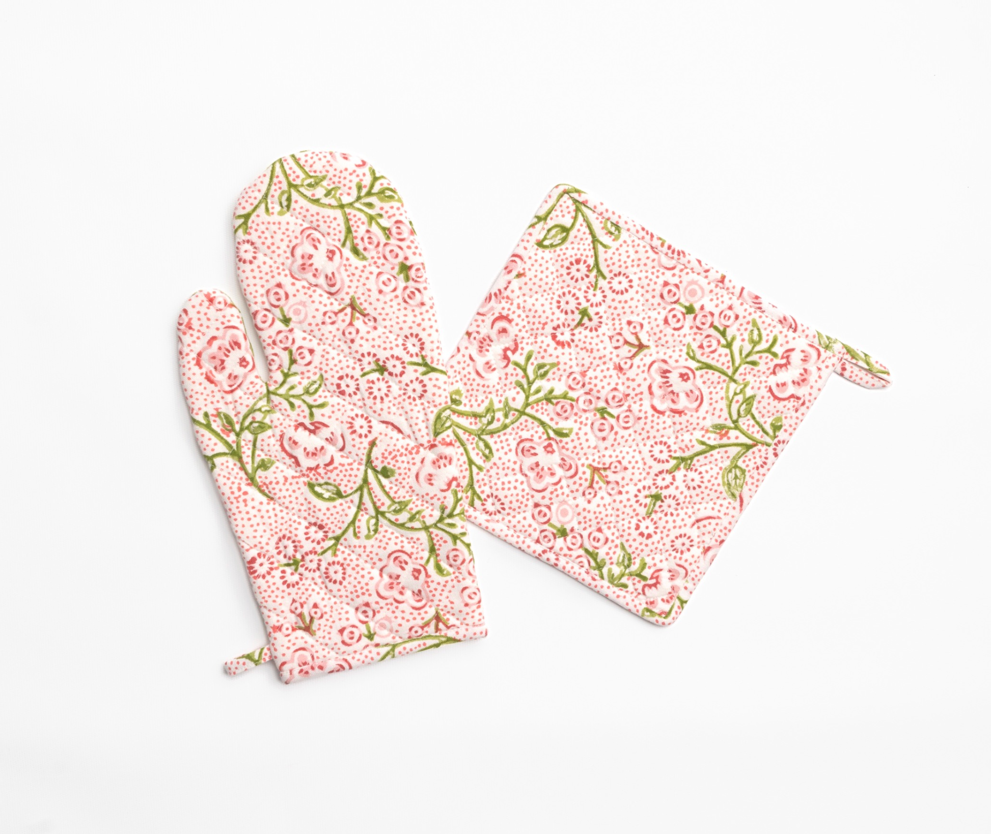 Floral-patterned oven mitt and pot holder on a white background