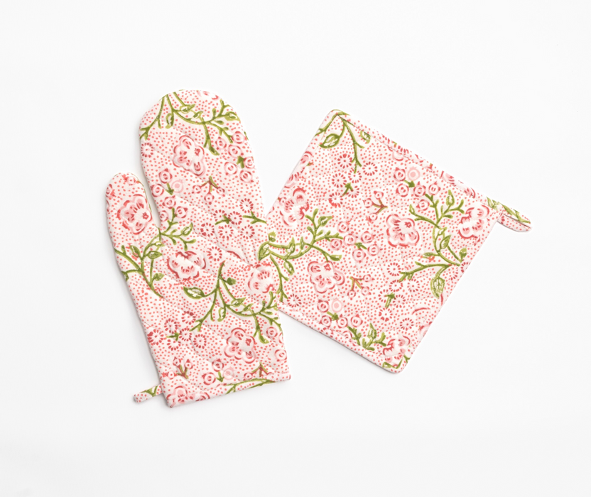 Floral-patterned oven mitt and pot holder on a white background