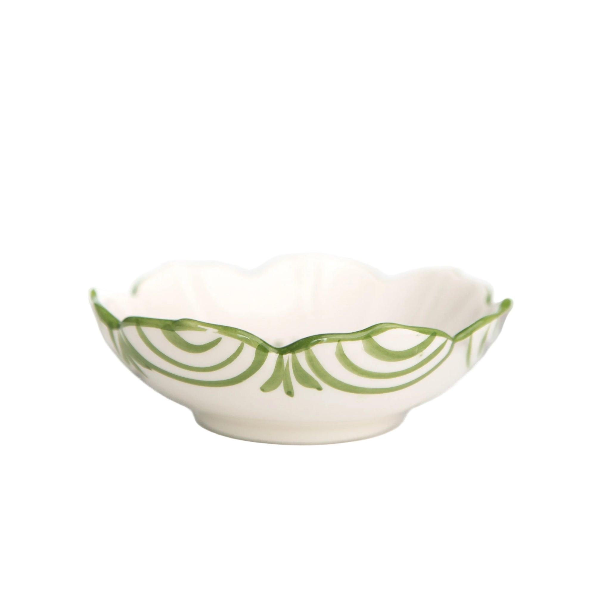 White bowl with green decorative pattern on a white background