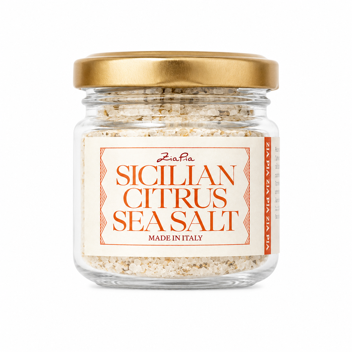 Italian citrus sea salt in glass jar on white background 