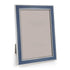 Picture frame in denim blue enamel with silver trim on white background 