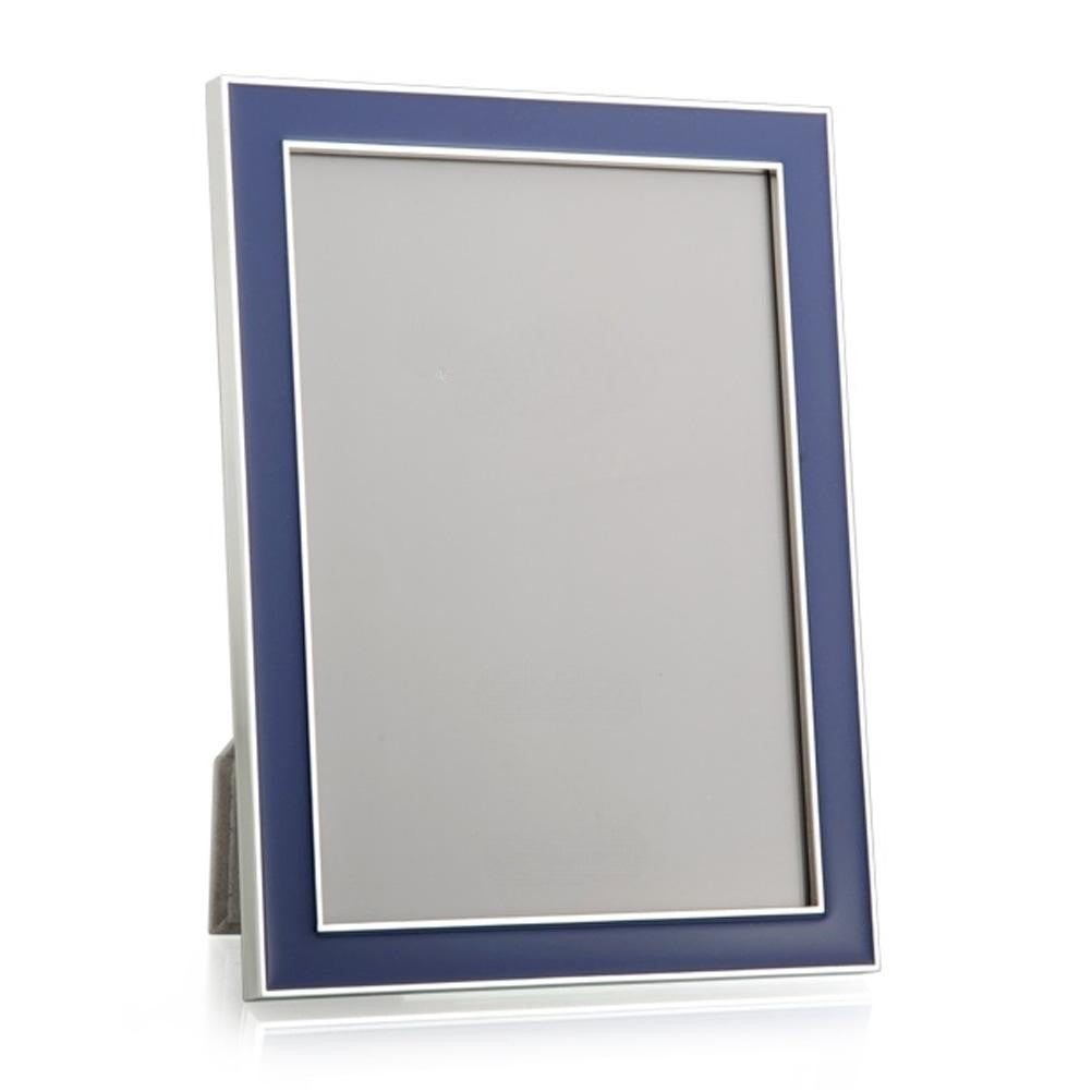 Picture frame in navy enamel with silver trim on white background 