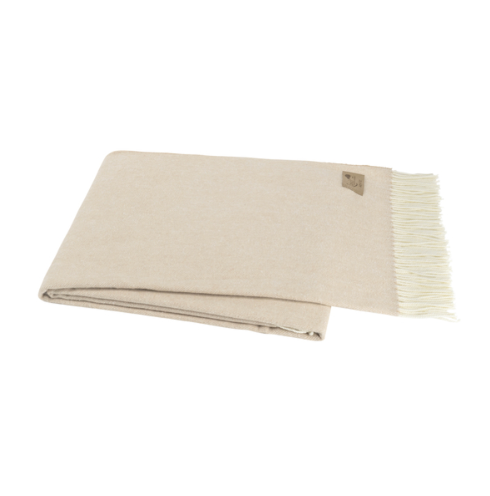 Beige blanket with white fringe on a white background