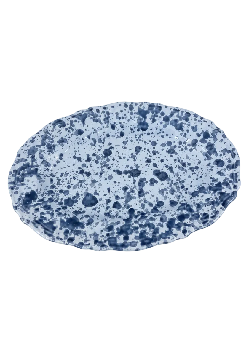 Blue speckled plate on a white background