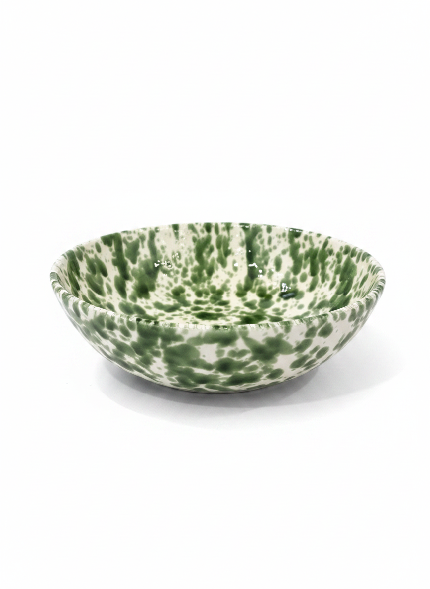 A ceramic bowl with a green and white speckled marbled pattern, photographed on a clean white background.