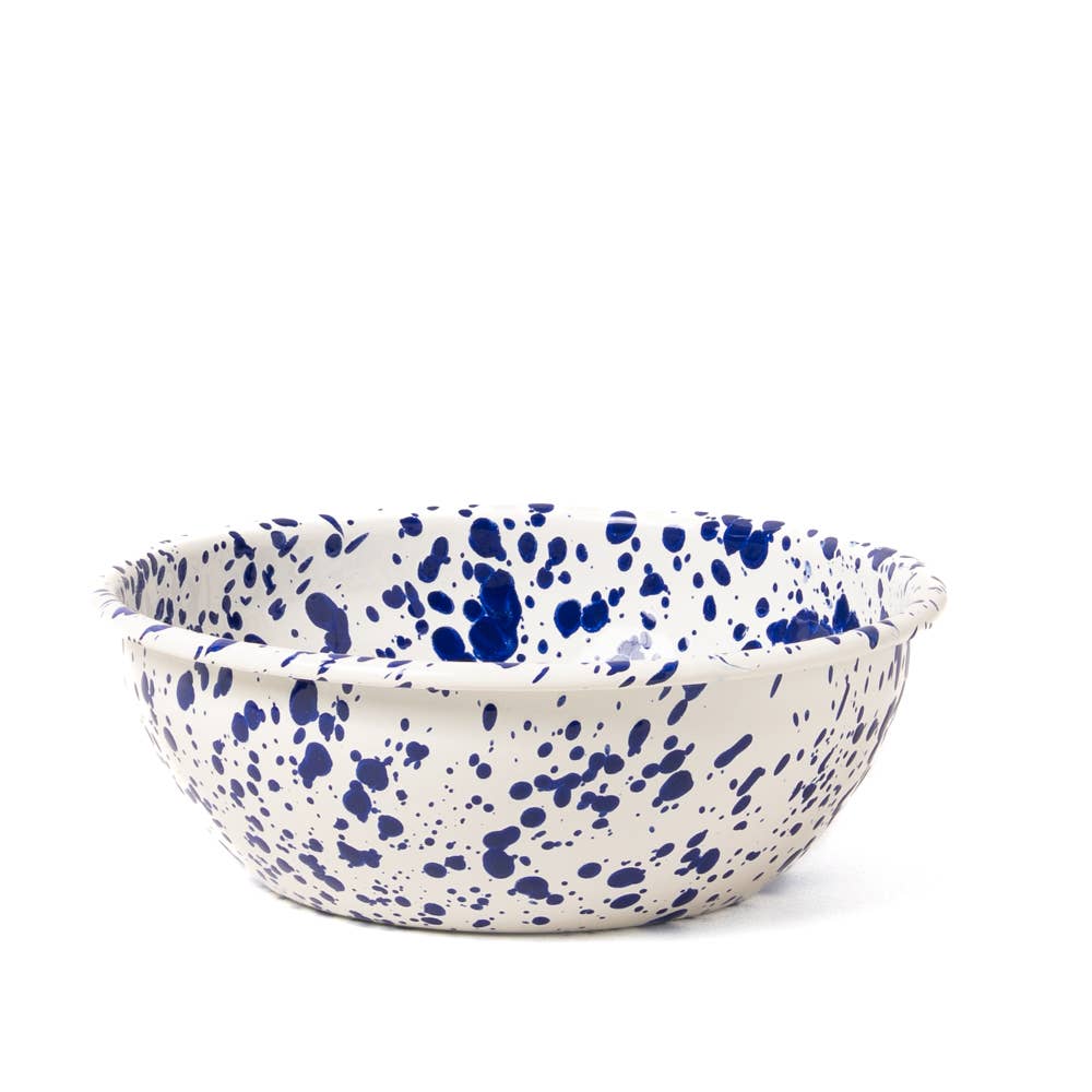 Speckled blue and white ceramic bowl on a white background