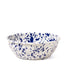 Speckled blue and white ceramic bowl on a white background