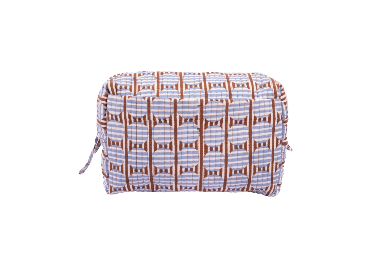 A rectangular zippered pouch with a geometric ikat pattern in brown, white, and light blue, shown against a plain white background.