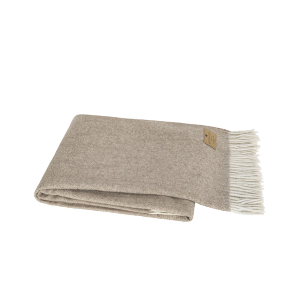 Gray blanket with white fringe on a white background