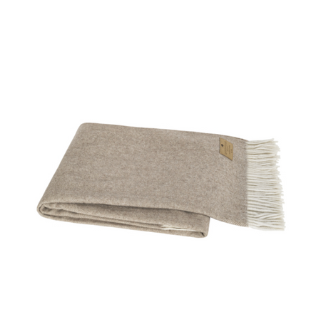 Gray blanket with white fringe on a white background