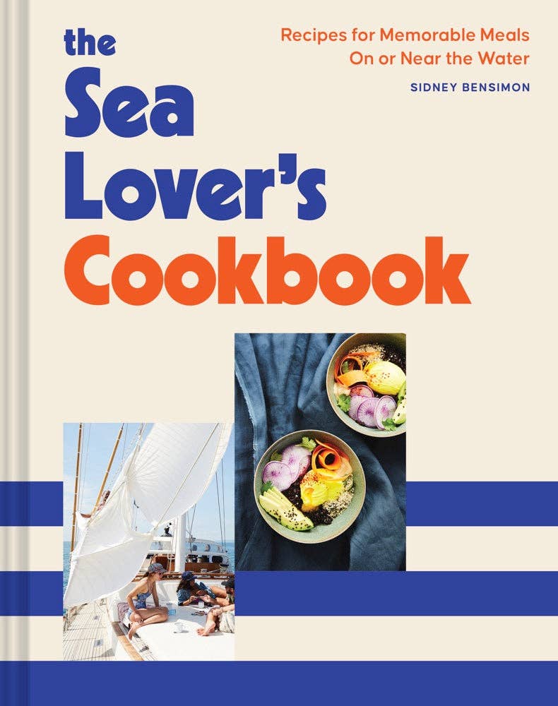 Cover of Sea Lovers cookbook, with blue stripes a sailboat, and dishes of food 