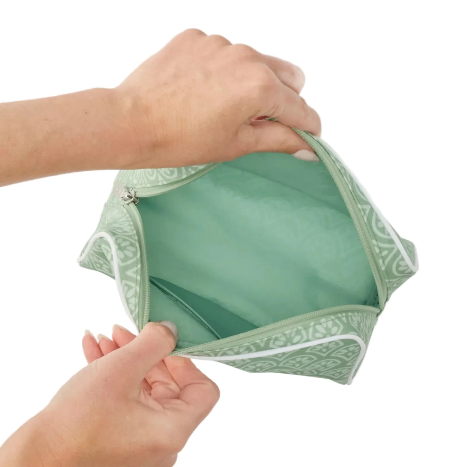 Inside of green block print toiletry bag on with zipper 